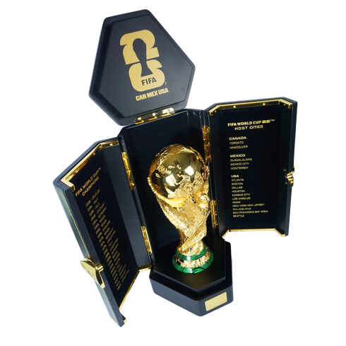 Golden FIFA World Cup trophy in an open black case featuring the 2026 North American logo, host cities, and past champions list.