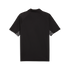 Back view of a black short-sleeved polo shirt with raglan sleeves and grey geometric patterns under the arms, set against a solid black background.