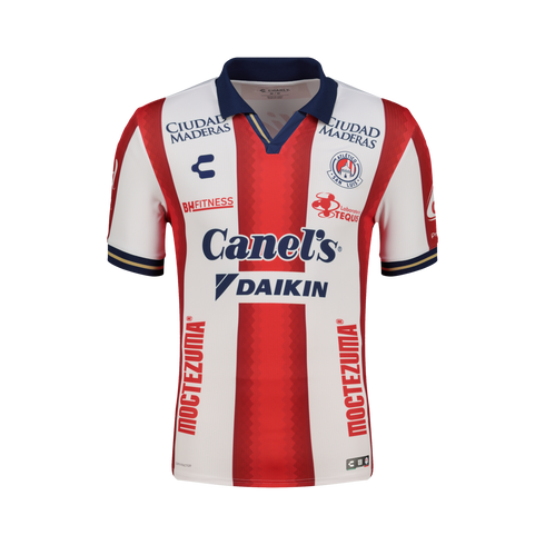 Atlético San Luis home jersey featuring red and white vertical stripes, a navy blue polo collar, and multiple sponsor logos, including Canel’s and Daikin, on the front.