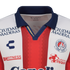 Close-up of an Atlético San Luis soccer jersey with red and white vertical stripes, a navy collar, and logos for Charly and several sponsors.