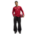 A man in a red long-sleeve Portugal soccer jersey (number 7) and baggy black jeans with a chain, holding a red soccer ball against a black background.