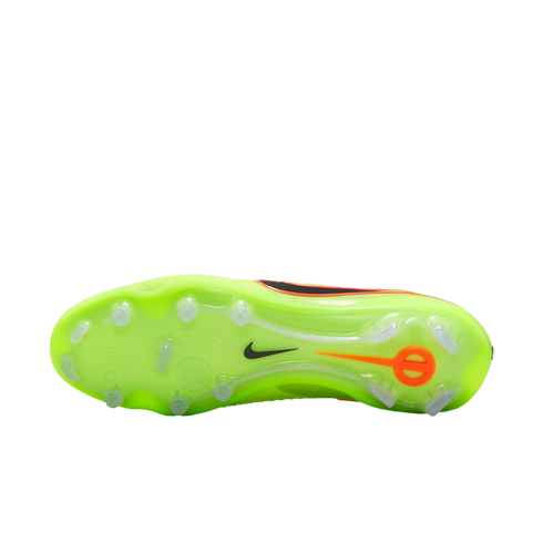 The sole of a neon green Nike soccer cleat with clear studs and a black swoosh, shown against a solid black background.