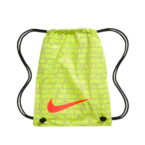 Neon lime green Nike drawstring bag with a repeating multi-language "Nike Soccer" text pattern and a large orange swoosh. Black cords form the shoulder straps.