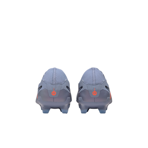Back view of two light grey soccer cleats with small red logos on the heels, centered against a solid black background.