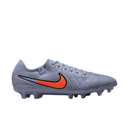 A light blue Nike Tiempo soccer cleat with a vibrant orange swoosh logo, shown in a profile view against a solid black background.
