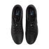 Overhead view of black Nike Tiempo soccer cleats on a black background, showing light blue logos on the inner soles.