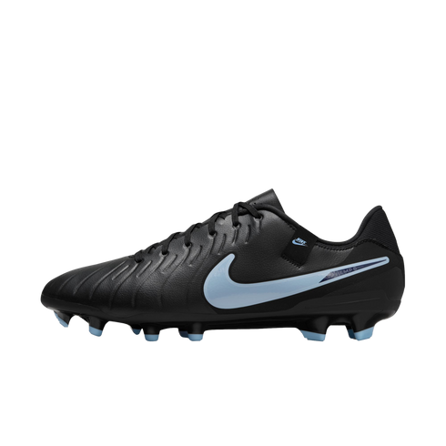 A black Nike Tiempo soccer cleat with a light blue swoosh and blue-tipped studs, set against a black background.