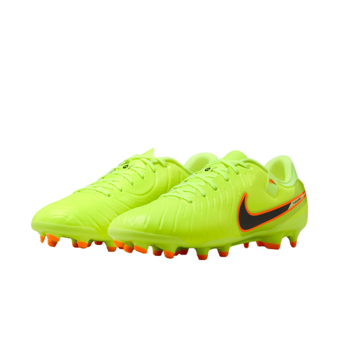 Neon yellow Nike Tiempo soccer cleats with a black swoosh and orange studs, against a black background.