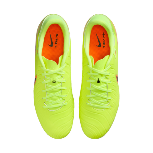 Top-down view of neon yellow Nike Tiempo soccer cleats with orange insoles and matching laces against a black background.