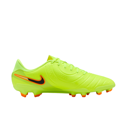 Profile view of a neon yellow Nike soccer cleat featuring a black and orange swoosh and orange-tipped studs, set against a solid black background.