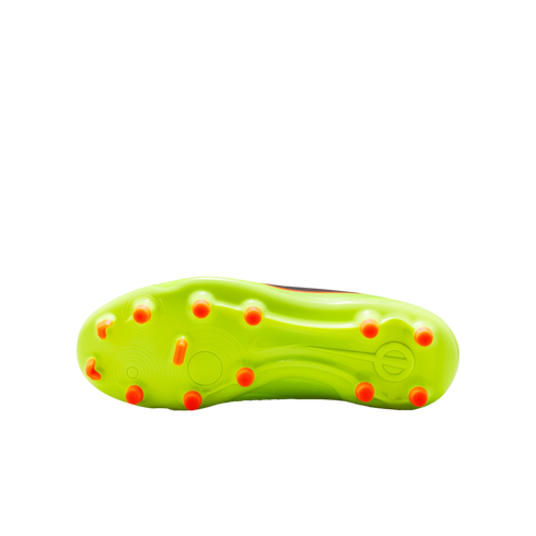 Bottom view of a lime green soccer cleat soleplate with bright orange studs, set against a black background.