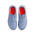 Top-down view of a pair of light blue Nike athletic shoes with bright orange interiors and orange Nike swooshes, set against a solid black background.