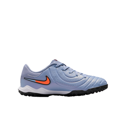 Profile view of a light purple Nike soccer turf shoe with an orange and blue Swoosh logo and a black nubbed outsole.