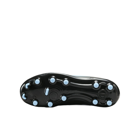 A bottom view of a black soccer cleat outsole featuring light blue circular and crescent-shaped studs, set against a solid black background.