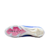 The underside of a blue and white Nike soccer cleat with a pink Air Zoom logo on the soleplate and clear studs against a black background.