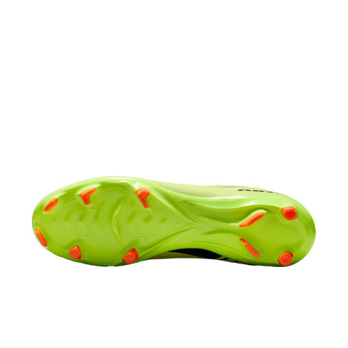 The neon lime green soleplate of a soccer cleat featuring bright orange studs and a textured grip pattern, shown against a solid black background.