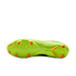 The neon lime green soleplate of a soccer cleat featuring bright orange studs and a textured grip pattern, shown against a solid black background.