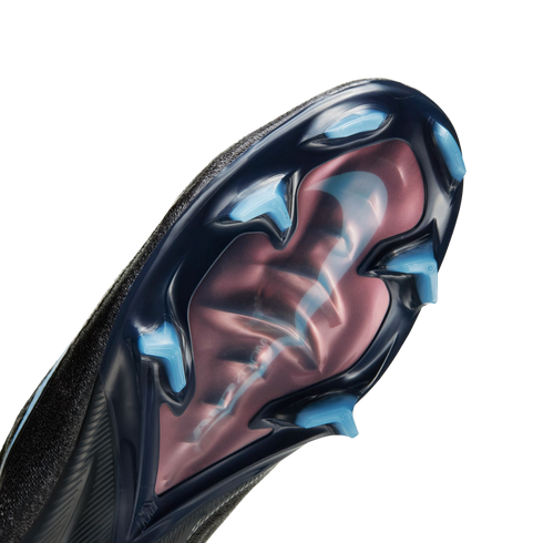 Close-up of a soccer cleat soleplate featuring light blue bladed studs and a translucent pinkish-red window with a Nike swoosh and "Air Zoom" text.