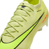 Close-up of a neon yellow Nike Gripknit soccer cleat with a black swoosh and textured upper.