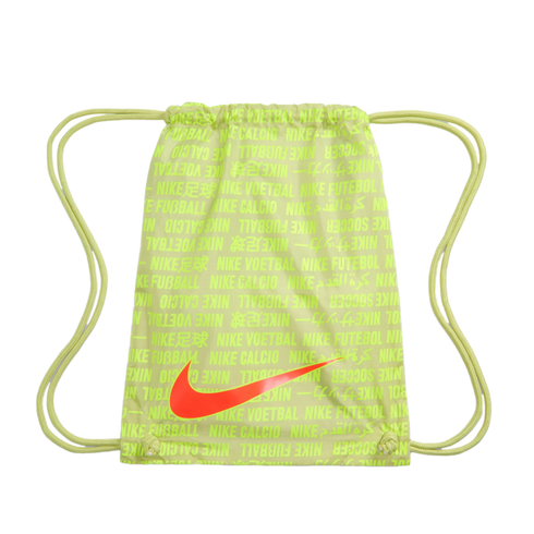 Lime green Nike drawstring bag with a large orange swoosh logo and a repeating multi-language soccer-themed text pattern.