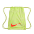 Lime green Nike drawstring bag with a large orange swoosh logo and a repeating multi-language soccer-themed text pattern.