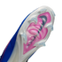 Close-up of the sole of a white and blue Nike soccer cleat featuring a pink "Air Zoom" plate and translucent studs against a black background.