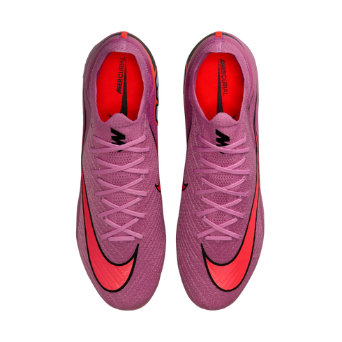 Top-down view of a pair of purple Nike Mercurial soccer cleats featuring bright red swooshes and orange interiors, set against a solid black background.