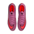 Top-down view of a pair of purple Nike Mercurial soccer cleats featuring bright red swooshes and orange interiors, set against a solid black background.