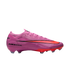 A side profile of a vibrant pink Nike Air Zoom soccer cleat with an orange-red swoosh and sole, set against a solid black background.
