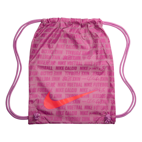 Pink Nike drawstring gym bag with a large orange swoosh logo and an all-over text pattern of "Nike" and international translations for "soccer."