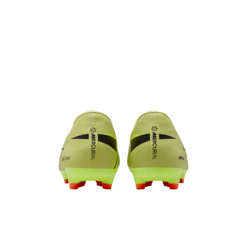Rear view of pale yellow Nike Mercurial soccer cleats with bright orange studs against a black background.