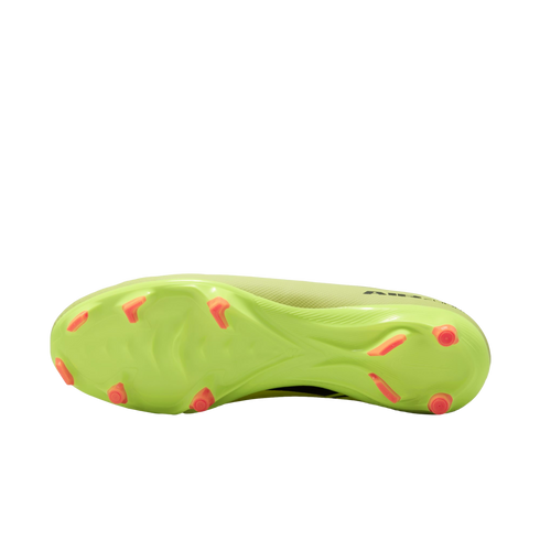 The bottom sole of a neon yellow soccer cleat with bright orange studs, shown against a black background.