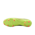 The bottom sole of a neon yellow soccer cleat with bright orange studs, shown against a black background.