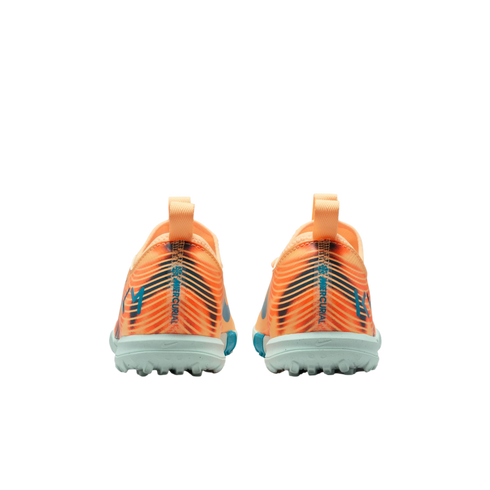 Rear view of orange and blue Nike Mercurial soccer shoes with teal turf soles, isolated on a black background.
