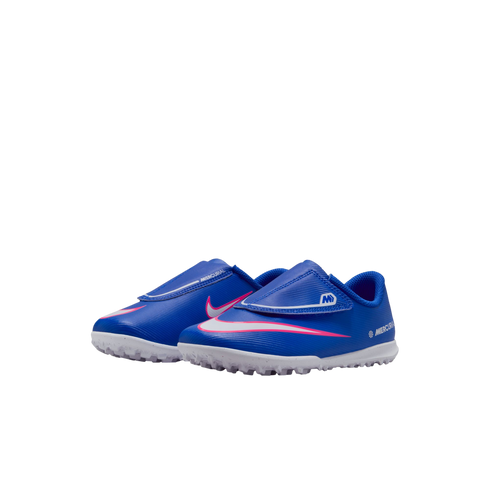 A pair of blue Nike Mercurial toddler soccer shoes with a pink and white swoosh and white turf outsoles.