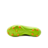 Neon green Nike soccer cleat soleplate with bright orange studs against a black background.