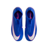 A top-down view of a pair of blue laceless Nike Mercurial soccer cleats with white and pink swoosh logos, set against a solid black background.