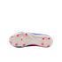 The white sole of a blue and pink soccer cleat, featuring bright pink studs against a solid black background.