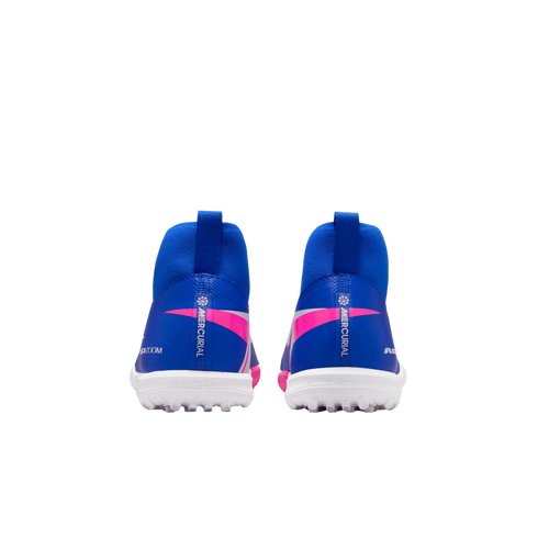 Rear view of blue Nike Mercurial high-top soccer cleats with white turf outsoles and pink accents against a solid black background.