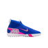 A blue Nike Mercurial laceless soccer turf shoe with pink and silver accents and a white studded sole, shown against a black background.
