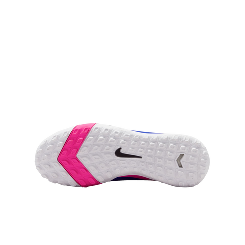 The white textured sole of a Nike shoe with a black swoosh logo and a bright pink chevron accent on the forefoot, shown against a solid black background.