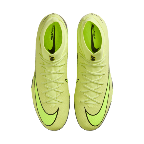 Top-down view of a pair of neon yellow Nike Mercurial soccer boots with black swooshes on a solid black background.