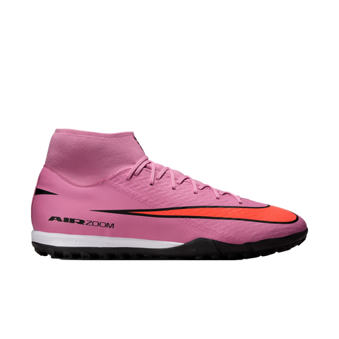 A pink Nike Air Zoom Mercurial soccer shoe with a large red swoosh, high-top collar, and black textured sole against a black background.