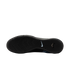 Bottom sole of a black Nike shoe with various textured grip patterns and a light blue swoosh logo in the center, displayed against a solid black background.