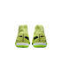 Rear view of neon yellow Nike Mercurial indoor soccer shoes featuring high-top collars and black branding on the heels, set against a black background.