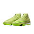 Pair of neon green Nike indoor soccer shoes with a high-top sock-like collar and black swooshes, set against a plain black background.