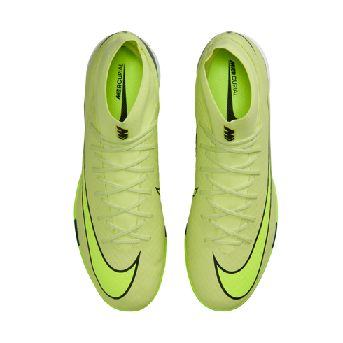 Top-down view of a pair of neon green Nike Mercurial soccer cleats with black swoosh logos and laces, set against a solid black background.