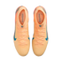 Top-down view of peach-colored Nike soccer cleats with blue swooshes and Kylian Mbappé branding on the insoles, against a black background.