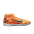Side profile of an orange Nike soccer shoe with blue branding and a white sole. Features a sock-like ankle collar and "KM" logo on the heel.