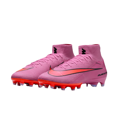 Pink and orange Nike Air Zoom soccer cleats with a high-top collar and black Swoosh logo, set against a solid black background.